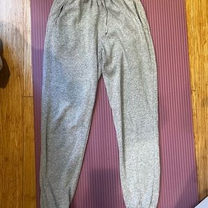 Grey jogger styled sweatpants with drawstring